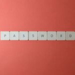 Password Managers vs. Passkeys security comparison image: lock icon and devices showing safer authentication across systems.