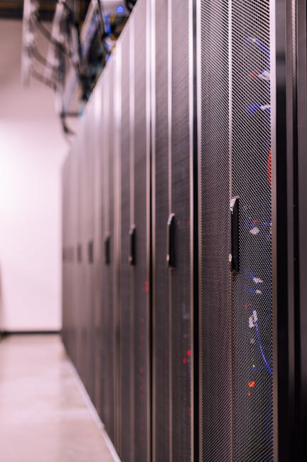 Security and IT team coordinating ransomware recovery in a server room with displays and consoles