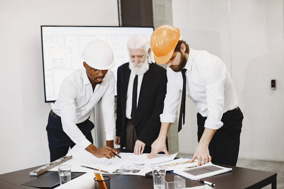 Security team reviewing a rollout checklist on laptops for passwordless implementation