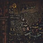 Threat modeling for beginners overview with a team discussing frameworks and writing effective scenarios on a whiteboard.