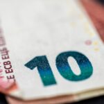 Top 10 Security News Topics to Watch This Month (And Why They Matter) with a cybersecurity-themed key and lock.