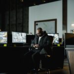 A security team reviewing threat reports, illustrating CISO vs. SOC Manager and security governance operations roles.