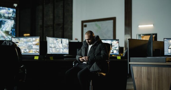 A security team reviewing threat reports, illustrating CISO vs. SOC Manager and security governance operations roles.