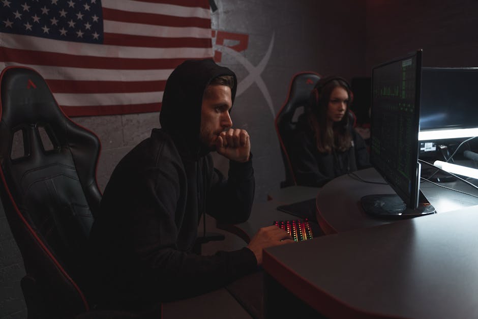 Security analyst reviewing scan dashboards and server data on multiple monitors