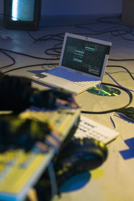 Security analyst reviewing attacker activity on a laptop during a red team exercise