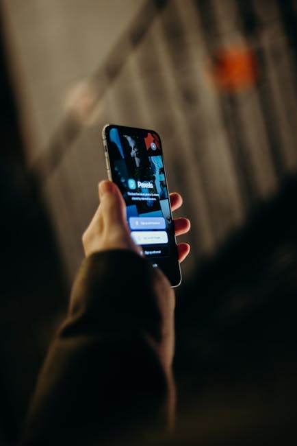 Person approving a passkey login on a phone with fingerprint prompt