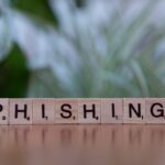 Infographic titled “Phishing vs. Social Engineering” with real-world examples and training tips to resist attacks.