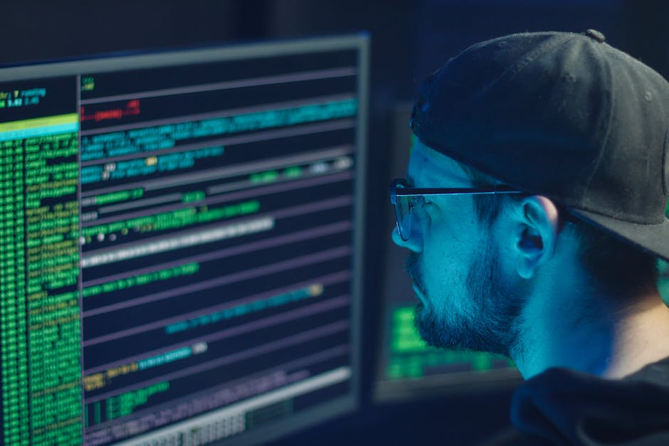 Security analyst reviewing logs and alerts on multiple screens during an incident