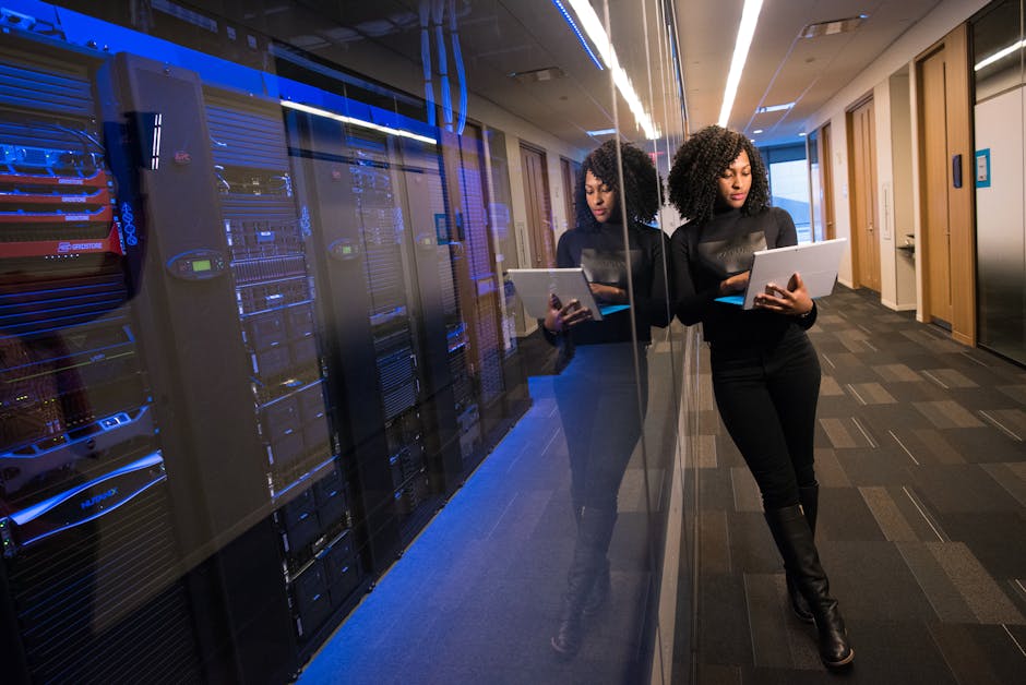 IT team rolling out patches in staged rings across a server room