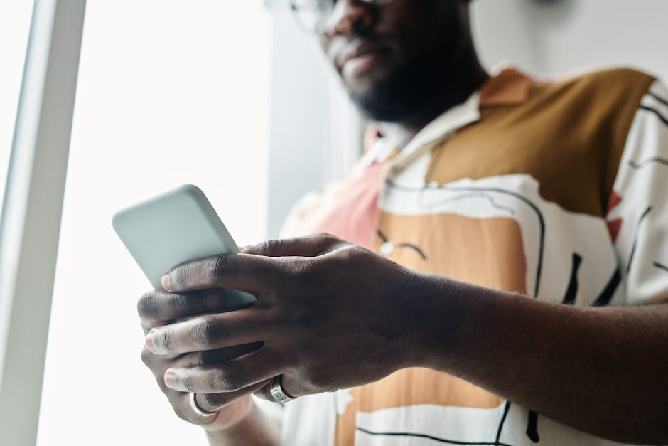 User viewing a one-time code on a phone during MFA sign-in