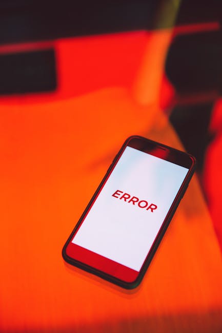 Person viewing a security alert on a smartphone, representing compromised device failure