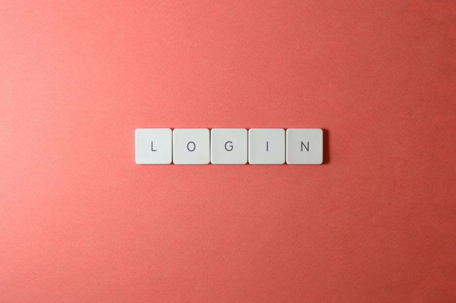 Security team reviewing identity and cloud logs on a multi-monitor dashboard